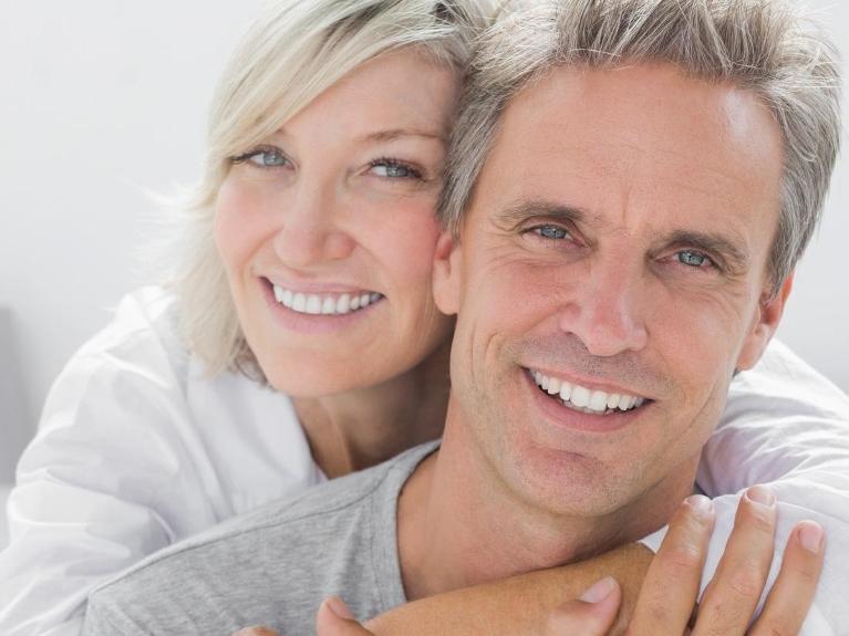 smiling couple with veneers in midland park 