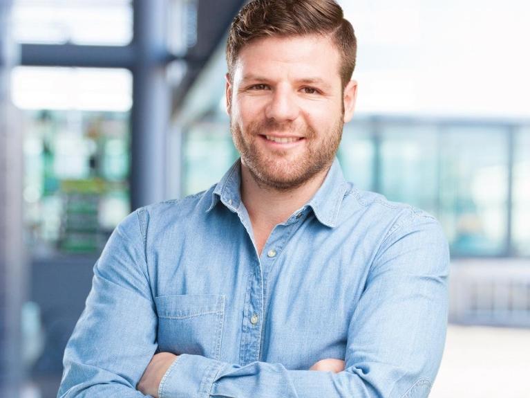 man smiling before cosmetic dentistry appointment 